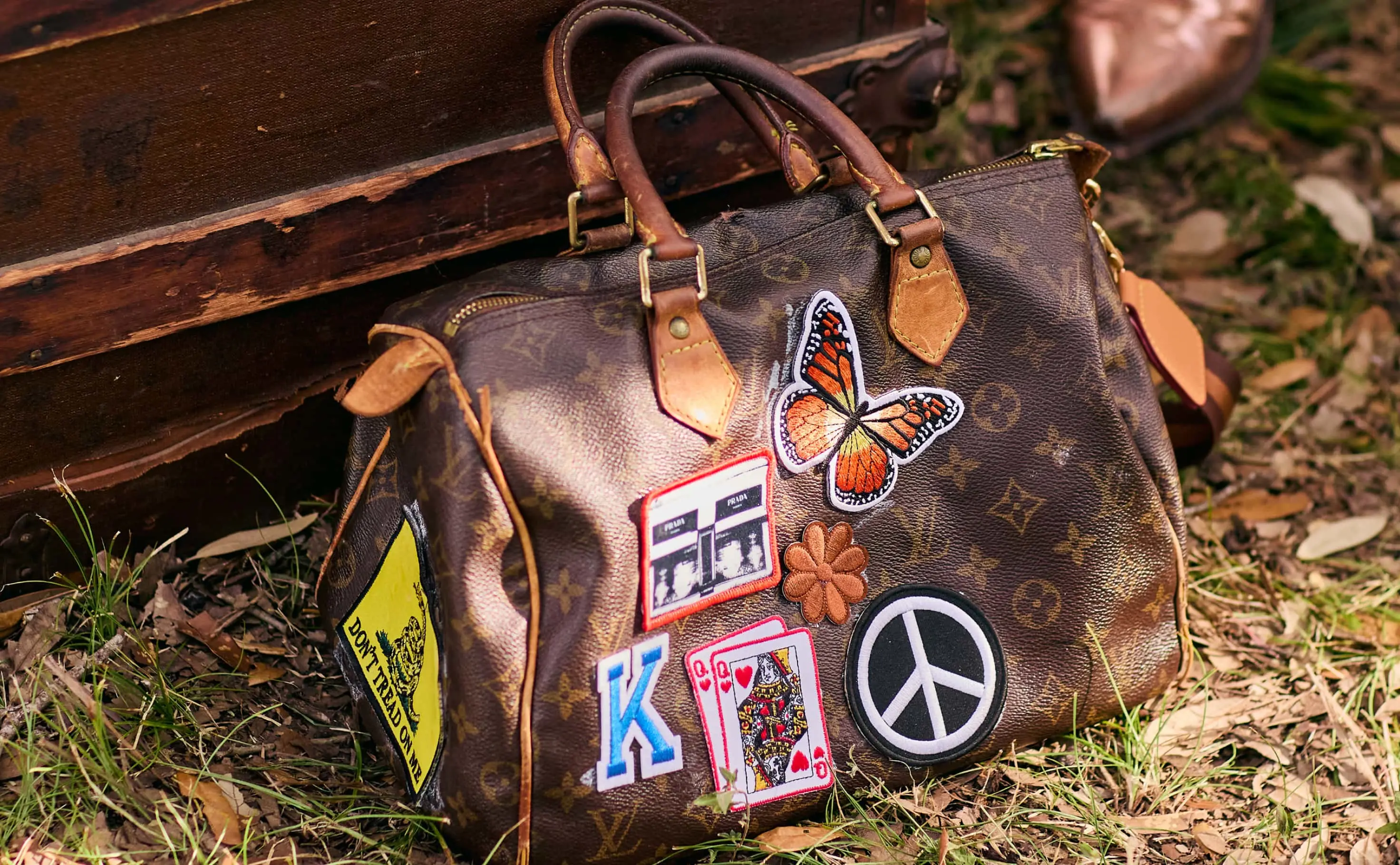 a purse with patches on it