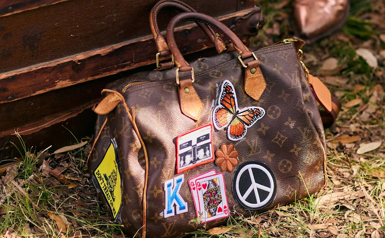 a purse with patches on it