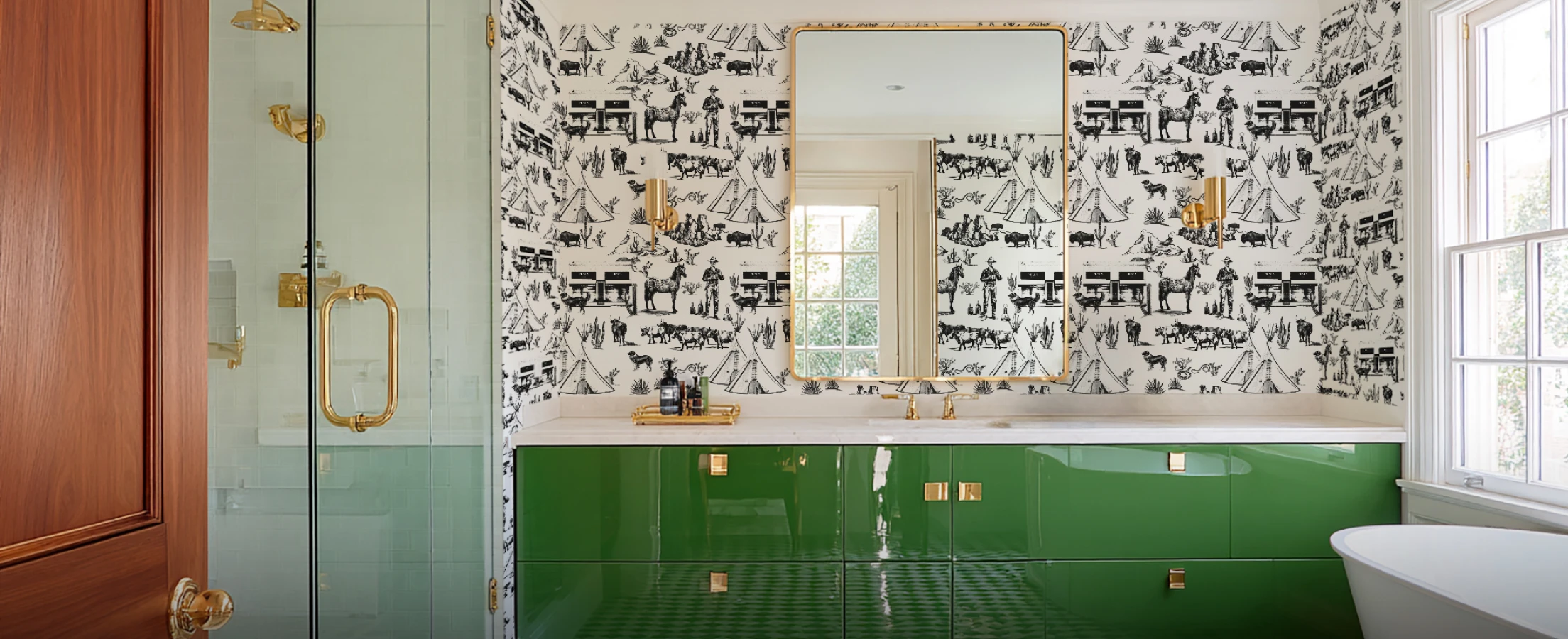 a bathroom with a green vanity and the marfa wallpaper