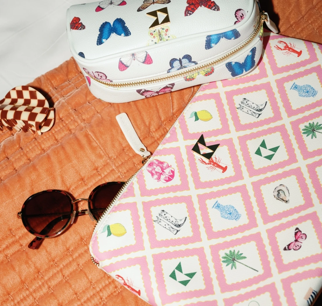 2 accessory bags, 1 large, 1 small in the mariposa and story print from katie kime