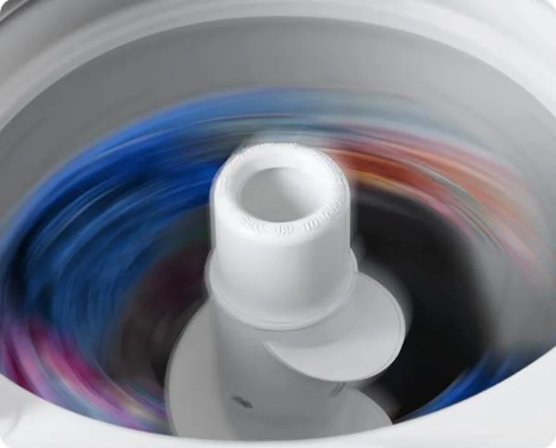 Spinning Washing Machine Drum With Colorful Clothes