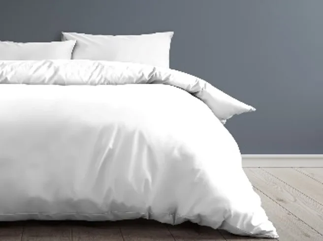 Clean White Bedding On A Neatly Made Bed
