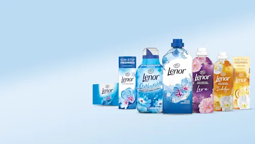 A Collection Of Lenor Products, Including Outdoorable And Spring Awakening, Displayed On A Light Blue Background