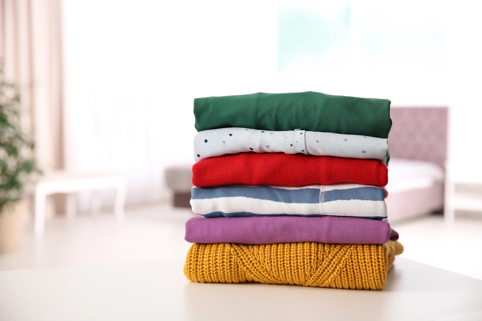 Coloured Clothes Folded On Table