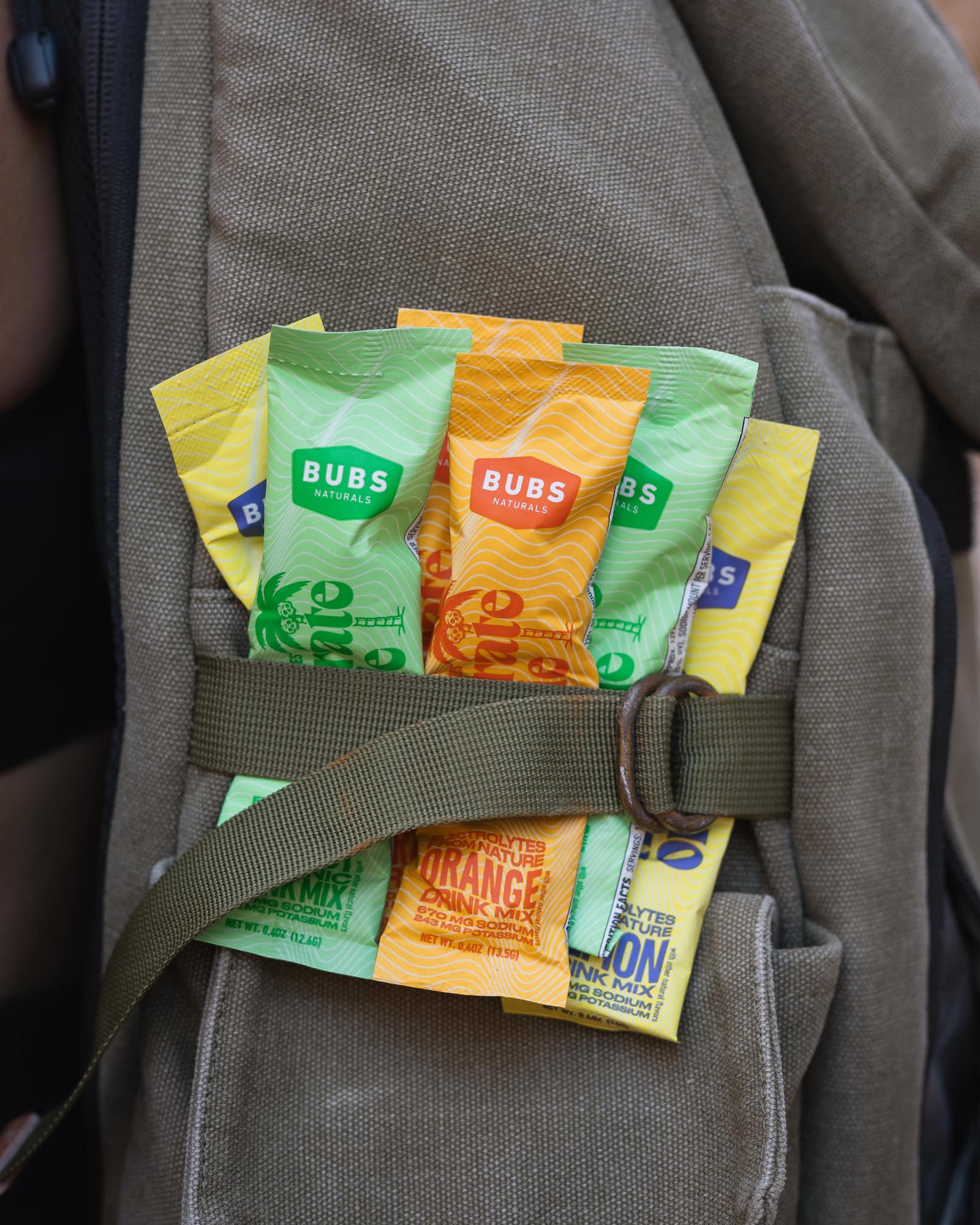 BUBS Naturals Hydrate or Die Electrolyte Packs being taken on hike in a backpack
