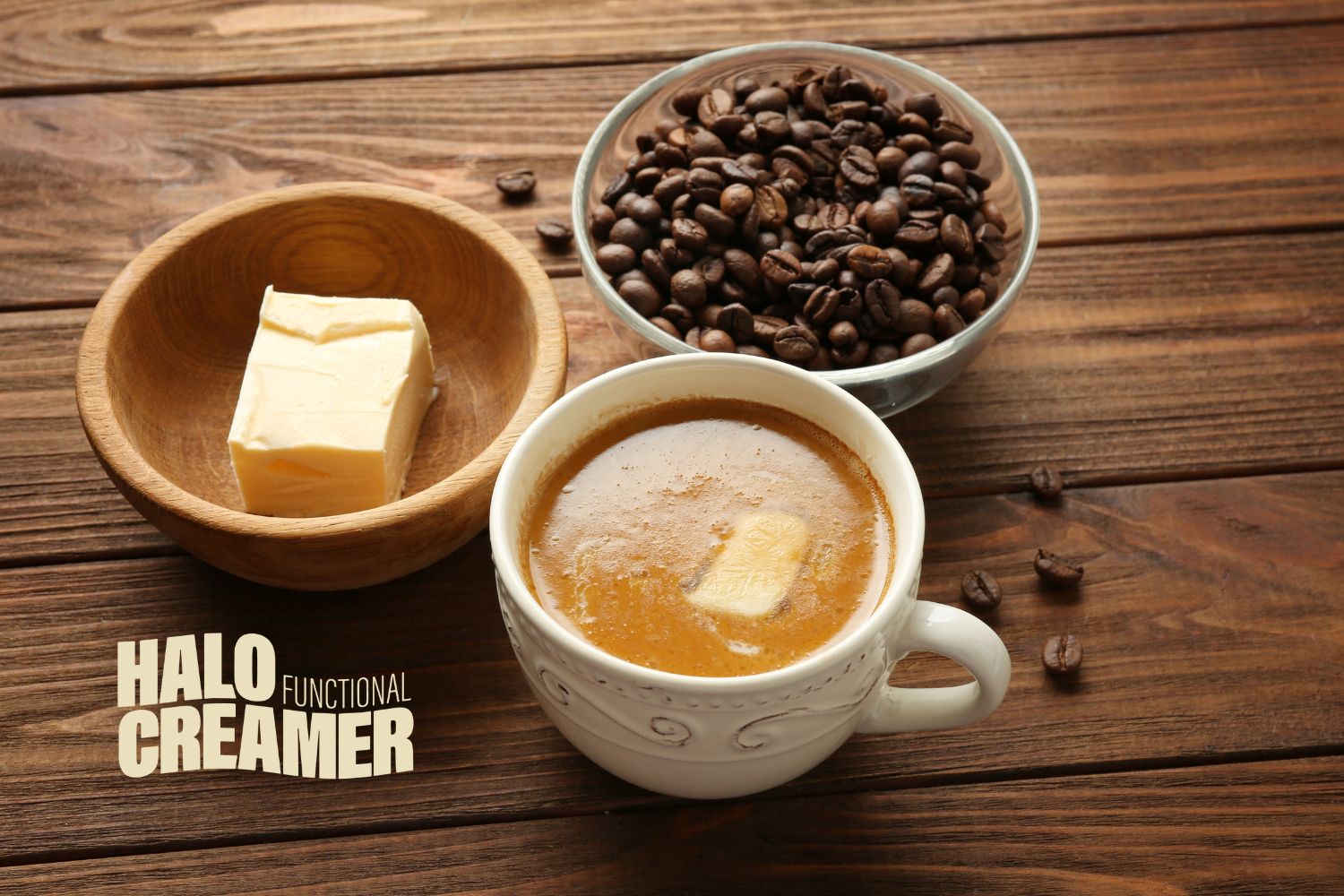 Melted Butter in a cup of coffee next to a stick of butter and coffee beans