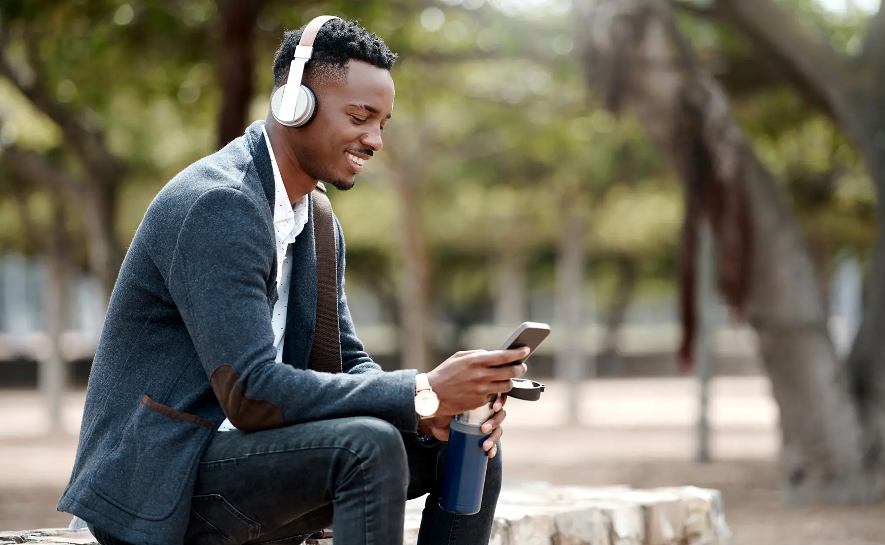 Young african american man listening to music.