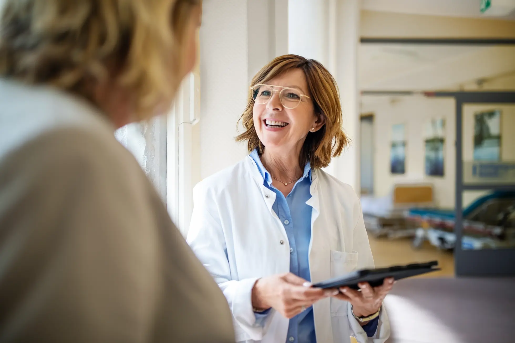 Woman consulting with a physician.