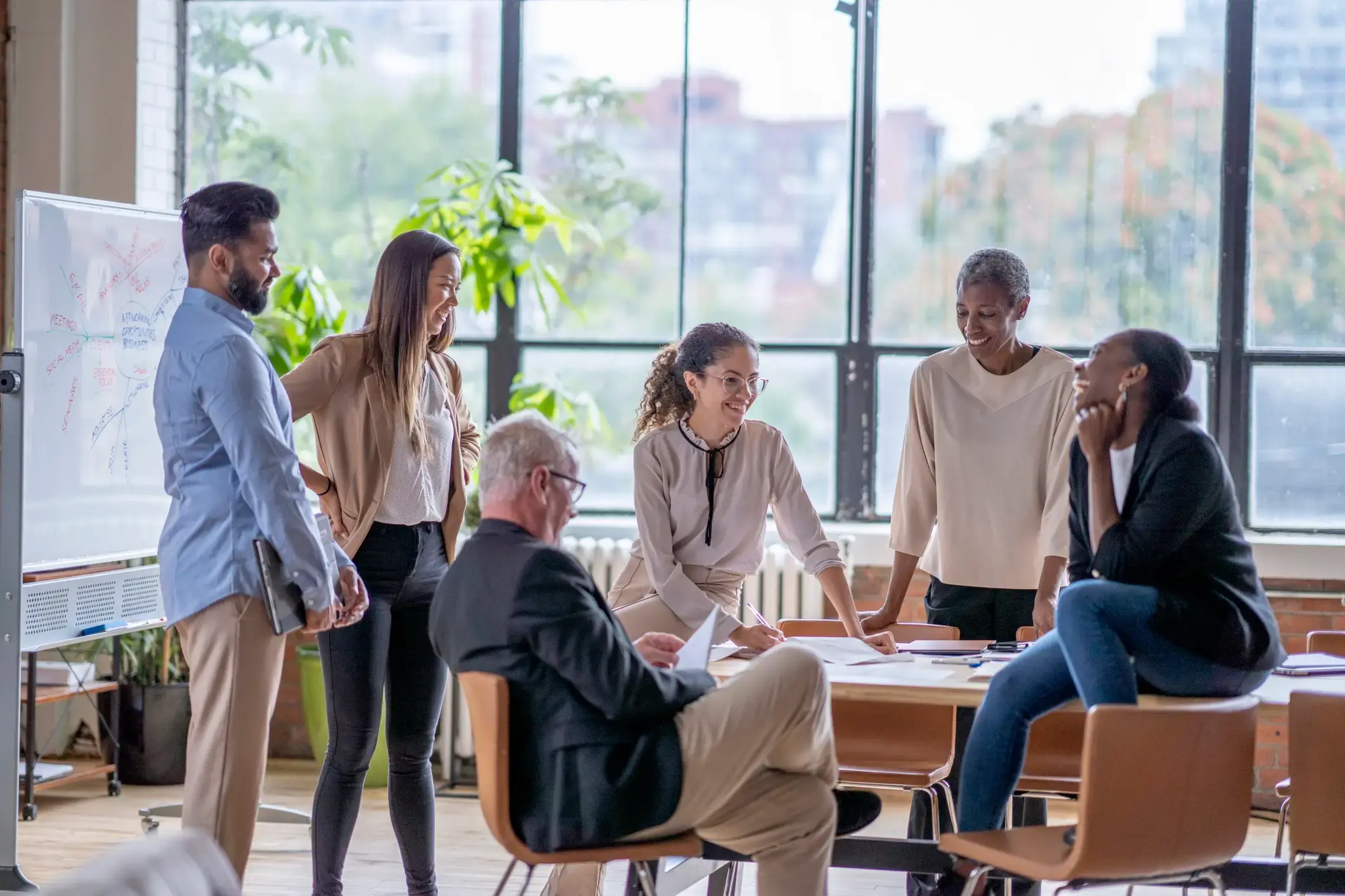 A group of business people having a meeting in an office.