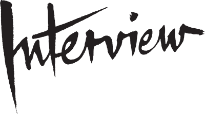 Interview magazine wordmark in black hand-lettered brushstroke script