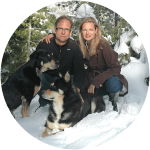 A dog named Madison posing with her fellow dog and his furparents before suffering from a fatal condition that is Salmon Poisoning.