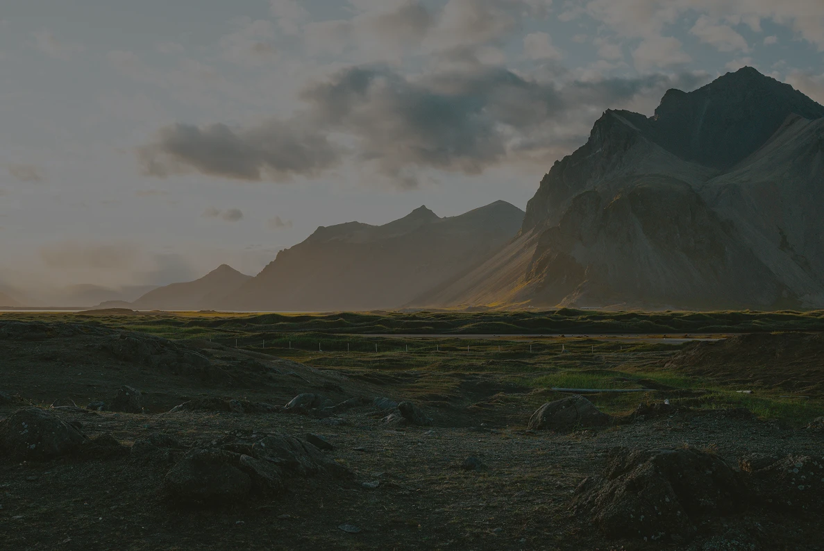 A dramatic mountain landscape at sunrise