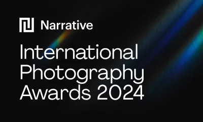 A dark promo image featuring bold white typography for the Narrative International Photography Awards 2024 alongside colorful diagonal light streaks.