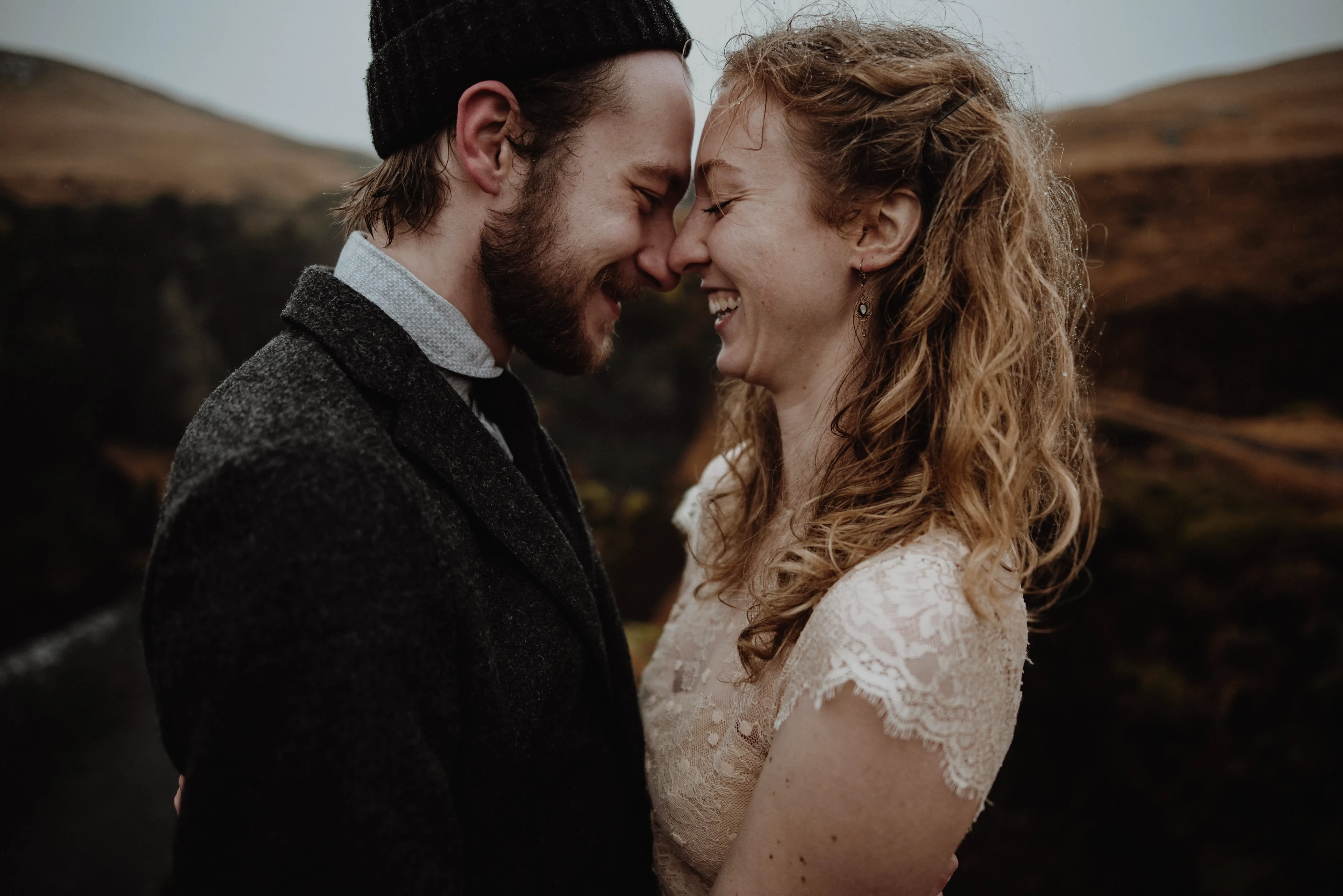 Image with couple smiling and laughing.