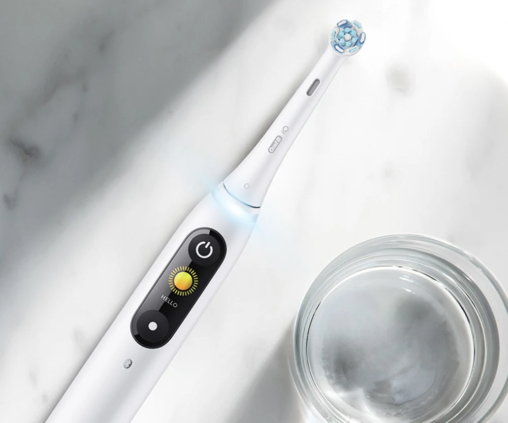 Close-up of iO Series 8 electric toothbrush LCD display and pressure sensor 