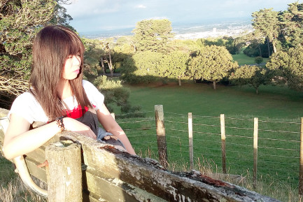 Filipino student outdoors near Auckland city in USA