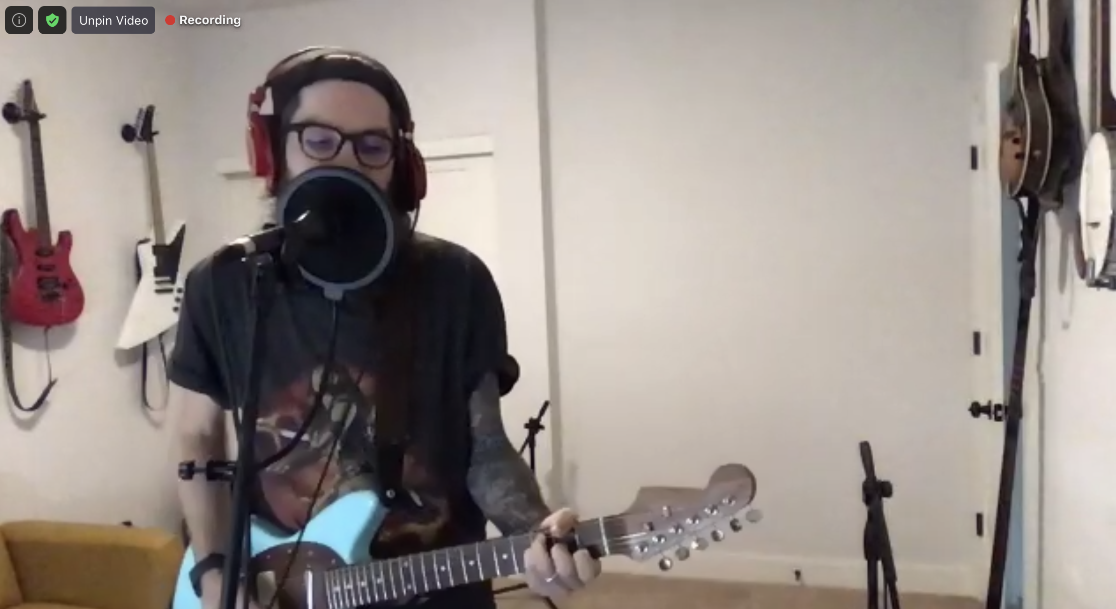 Matt playing guitar on Zoom