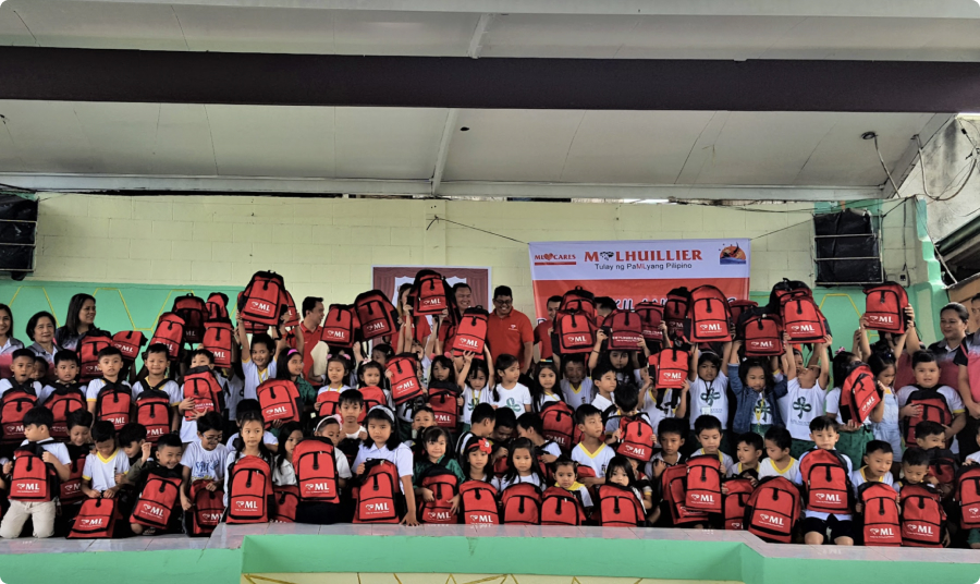 M Lhuillier Stands behind the Adopt a School Program