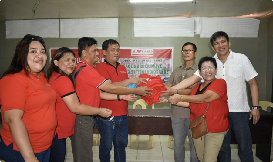 M Lhuillier Helps Put Up Road Signs