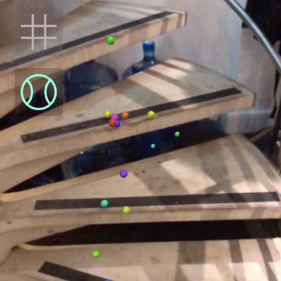A screenshot of the WebAR "bouncing spheres" experiment