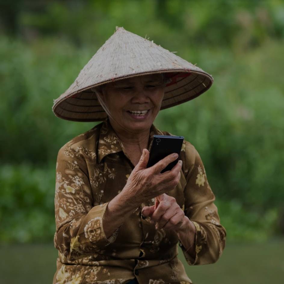 A Vietnamese woman using a mobile smartphone