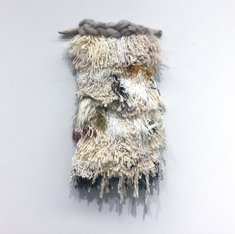 Untitled, 2017. Driftwood, roving wool and yarn. 20 × 10 inches.