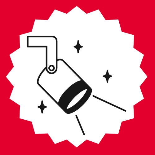 A black and white spotlight, shining with three black sparkles and a beam pointing to the bottom right. The background is a vibrant red.