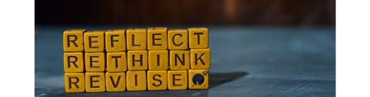 Blocks stacked say 'Reflect, rethink, revise'