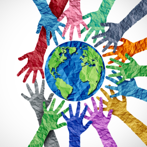 A picture of a variety of multicoloured, paper hands, surround a picture of the globe.