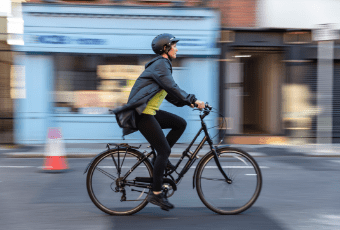 You’re in control A commuter on a cycle in a blurry surrounding