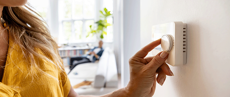 Woman adjusting dimmer