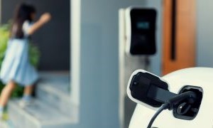 Home ev charger with girl in background