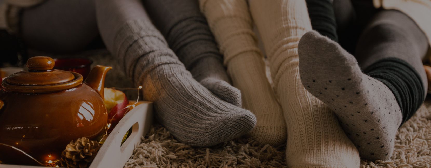 Hero Image Banner (7) Three sets of children's feet wearing socks