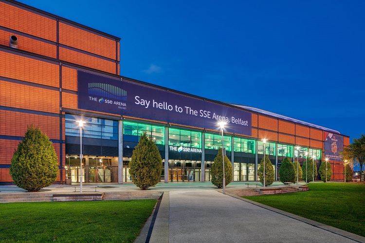 An SSE Arena banner displayed on a building with the text "Say hello to the SSE Arena Belfast"