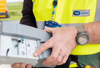 Smart meters are being installed for free An ESB worker holding a smart meter