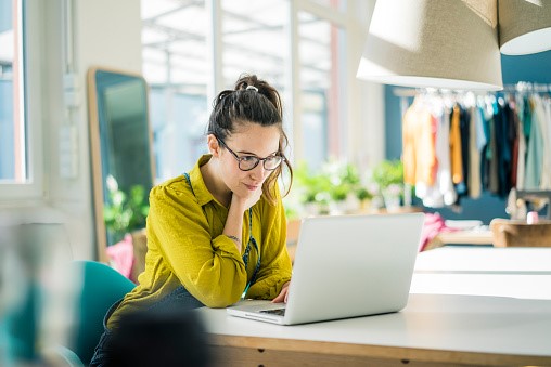A woman working on a laptop