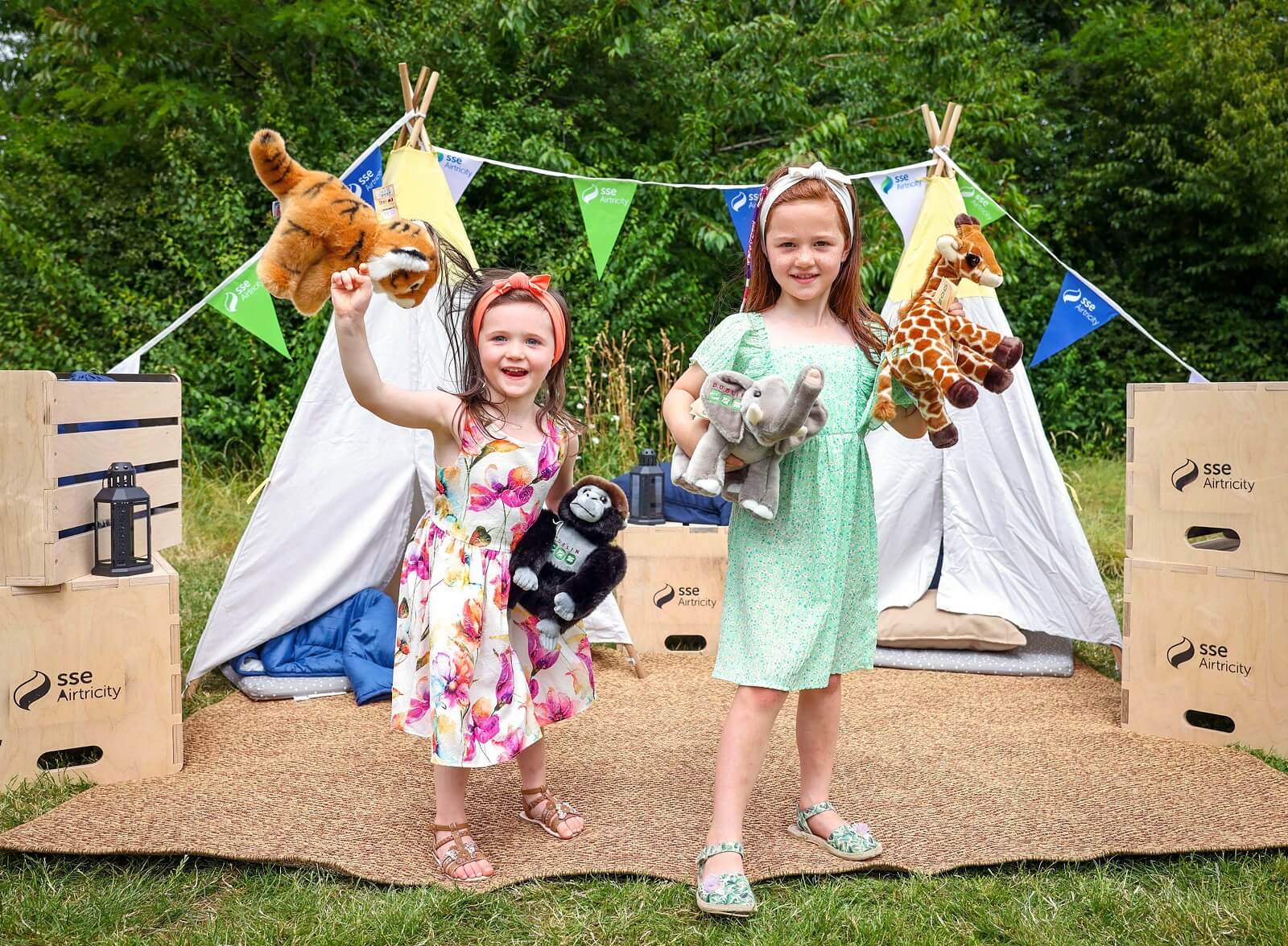 dublin zoo - snoar & roar! Two children playing with stuff animals in a camp site