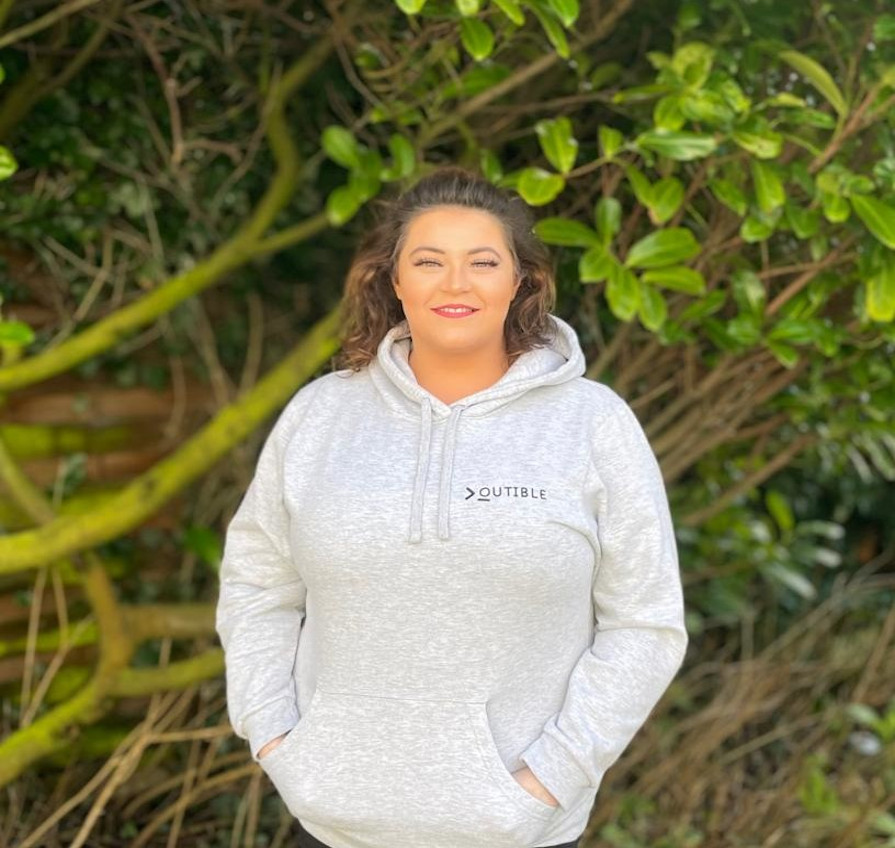 Hollie Winter (website developer) wearing Outible branded hoody