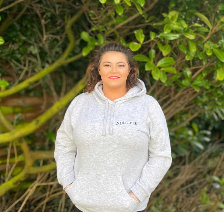 Hollie Winter (website developer) wearing Outible branded hoody