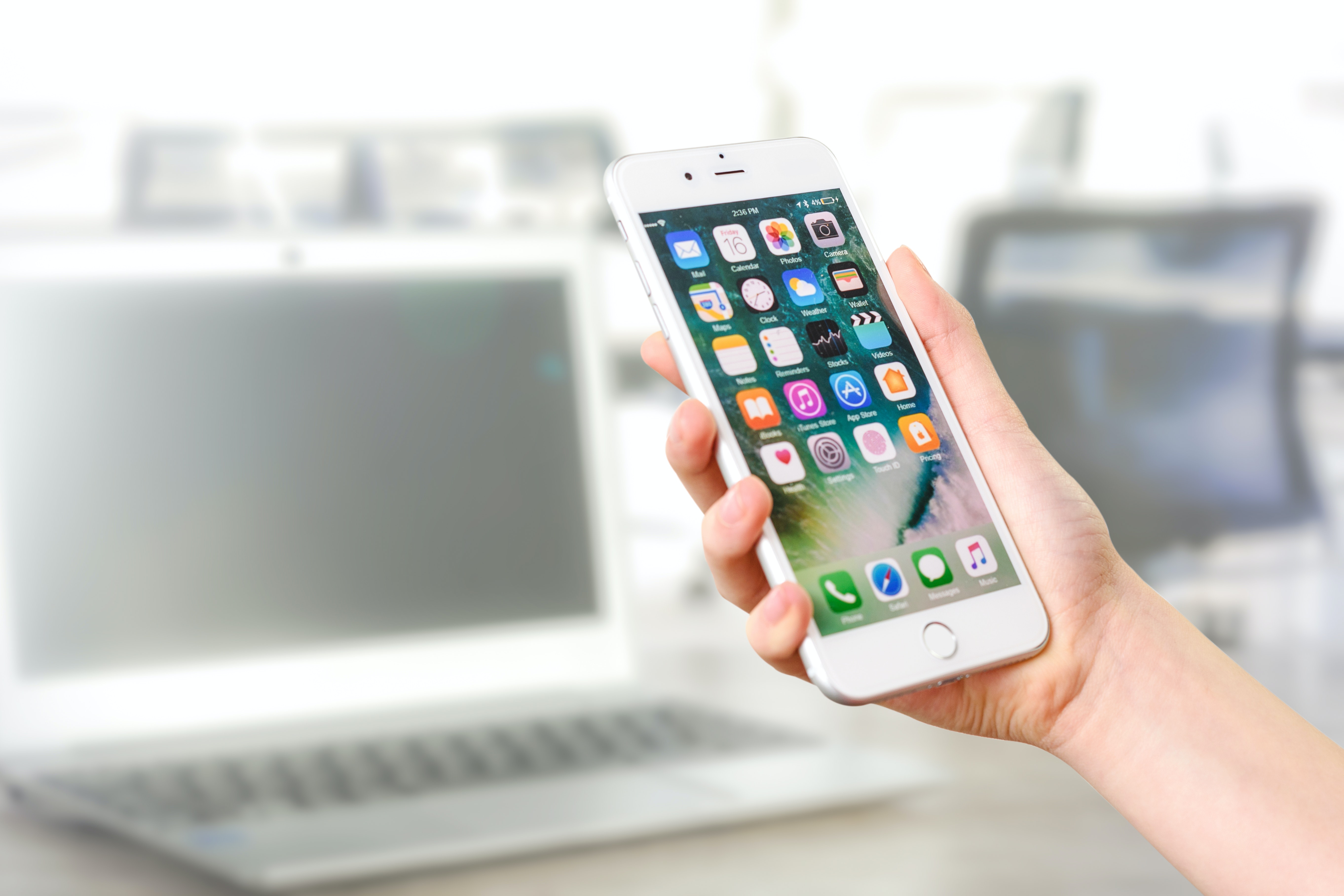 Developed mobile apps showing on screen of IOS device