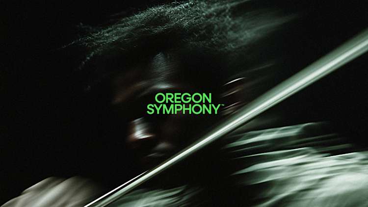 Oregon Symphony logo in bright green text, set against a dramatic black background with dynamic diagonal motion blur effects, creating an abstract, modern composition that evokes musical movement.