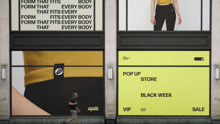 A mockup of EYDA marketing on large windows of a building