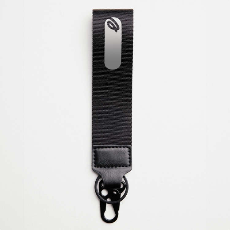 A black EYDA keychain on a white background