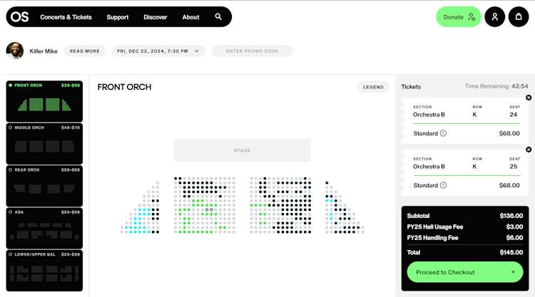 Concert venue seating selection interface for a performance. Shows interactive seating map with sections ranging from Front Orchestra to Upper Balcony with their price ranges. Two seats are selected in Orchestra B, Row K (seats 24-25) with their price. Shopping cart shows subtotal, fees, and total cost. Features countdown timer and green checkout button.