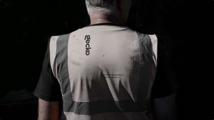 photo of a male worker wearing a gecko safety vest