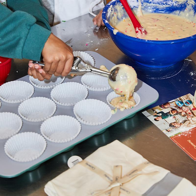 Boy Filling Cupcake Tin