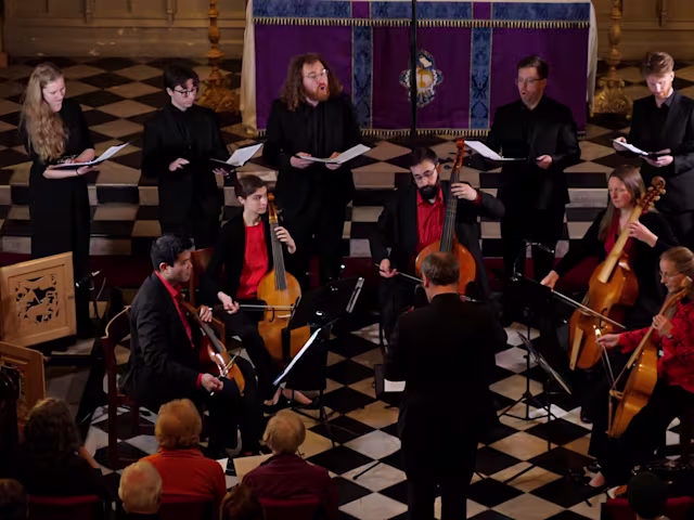A Heavenly Harmony Early music viol consort Chelys Consort and Vespri singers performing in a church with distinctive chequered flooring