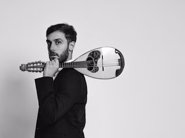 Vivaldi Mandolin & Violin Concertos a man holding a mandolin over his shoulder in black and white