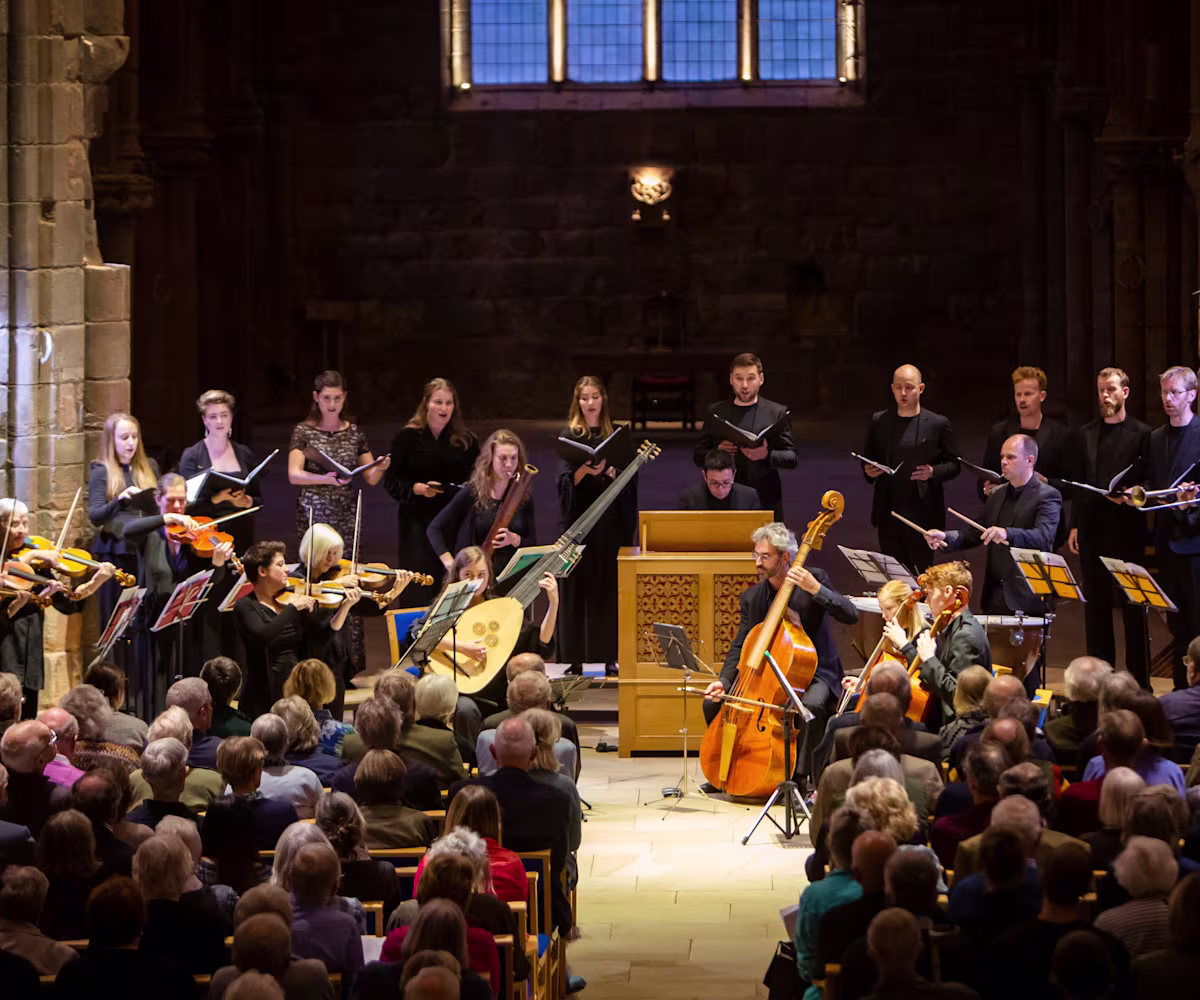 Dunster Festival Finale A period instrument ensemble, Spiritato, and choir performing to a packed audience in a moodily lit church