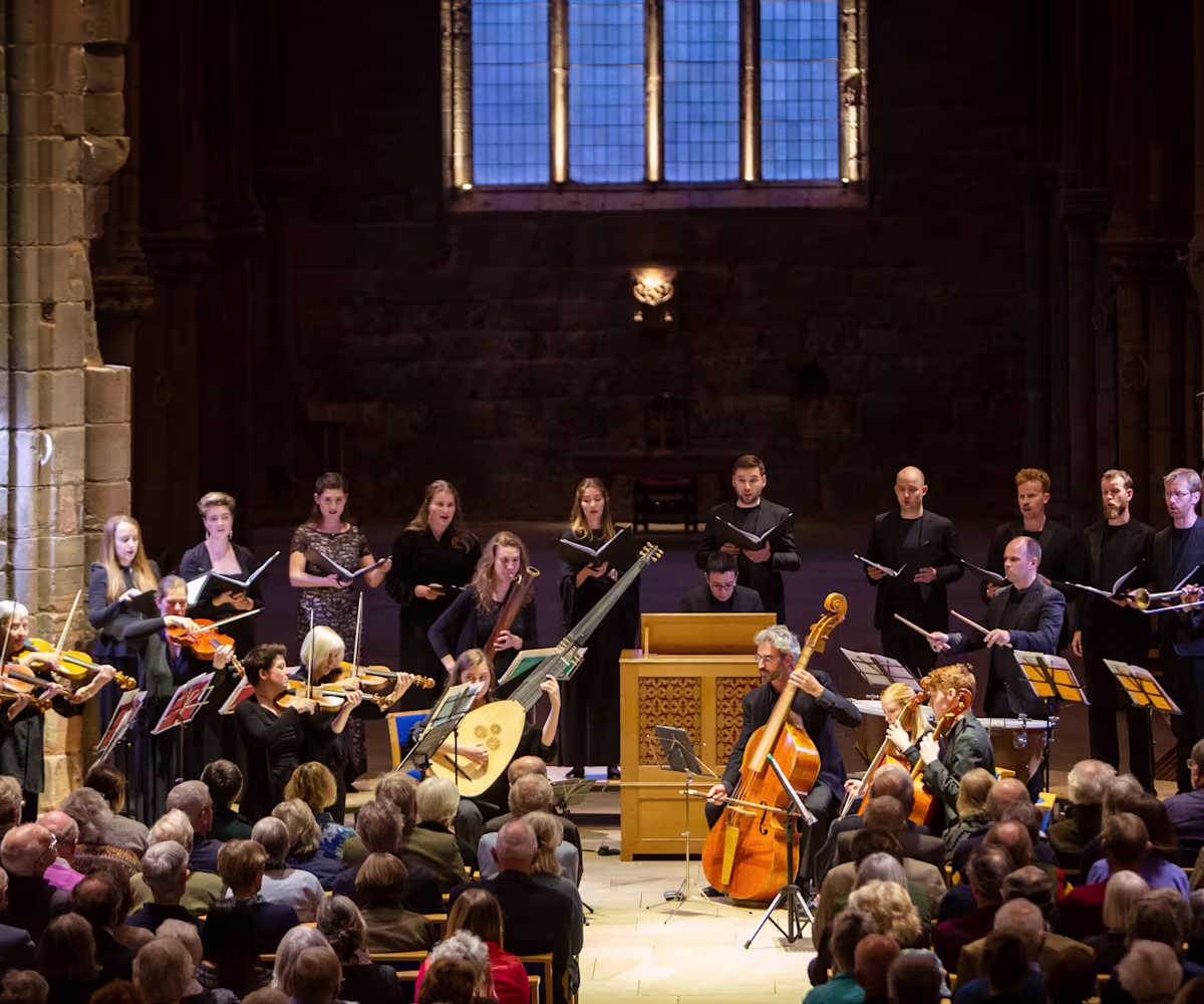 Dunster Festival Finale A period instrument ensemble, Spiritato, and choir performing to a packed audience in a moodily lit church